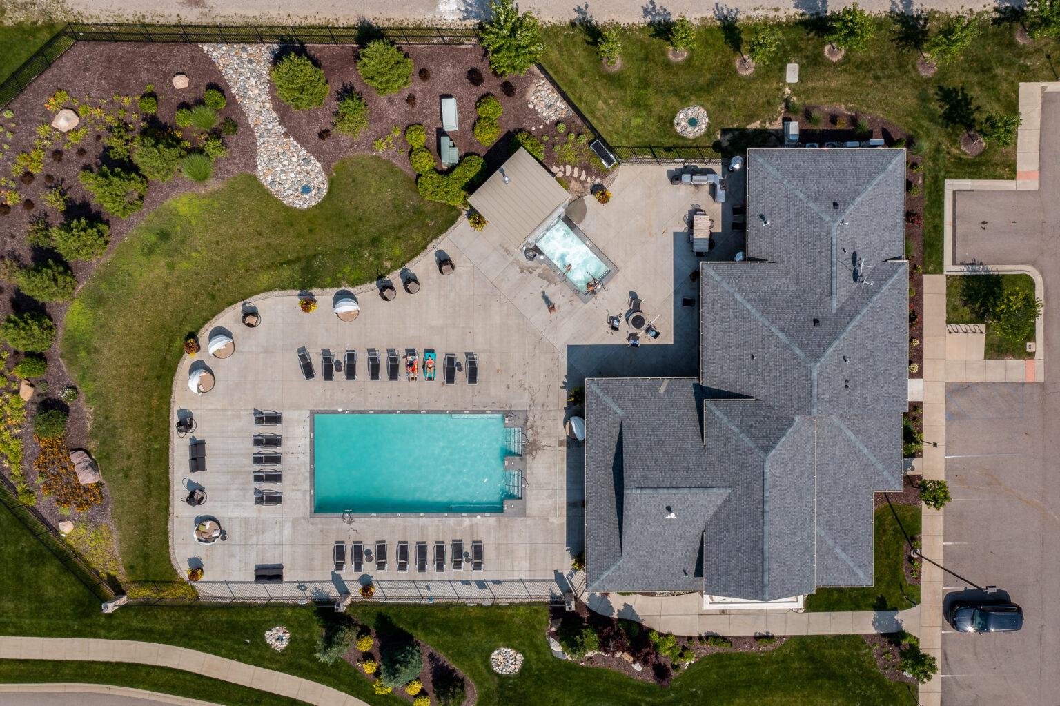 Aerial drone photography of the pool at The Quarry Apartments in Bath, MI